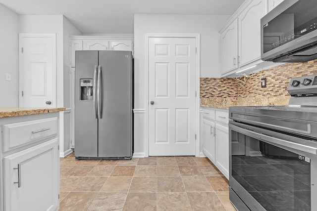 4788 Shadow View Ln, Bartlett, TN 38002 - kitchen with stainless steel appliances, white cabinetry, tasteful backsplash, and light stone finish flooring