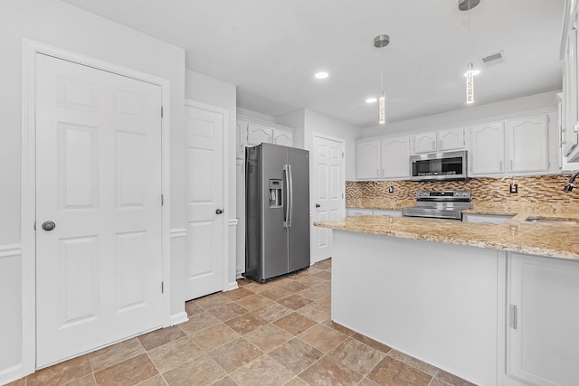 4788 Shadow View Ln, Bartlett, TN 38002 - kitchen with stainless steel appliances, a peninsula, white cabinetry, light stone counters, and a sink