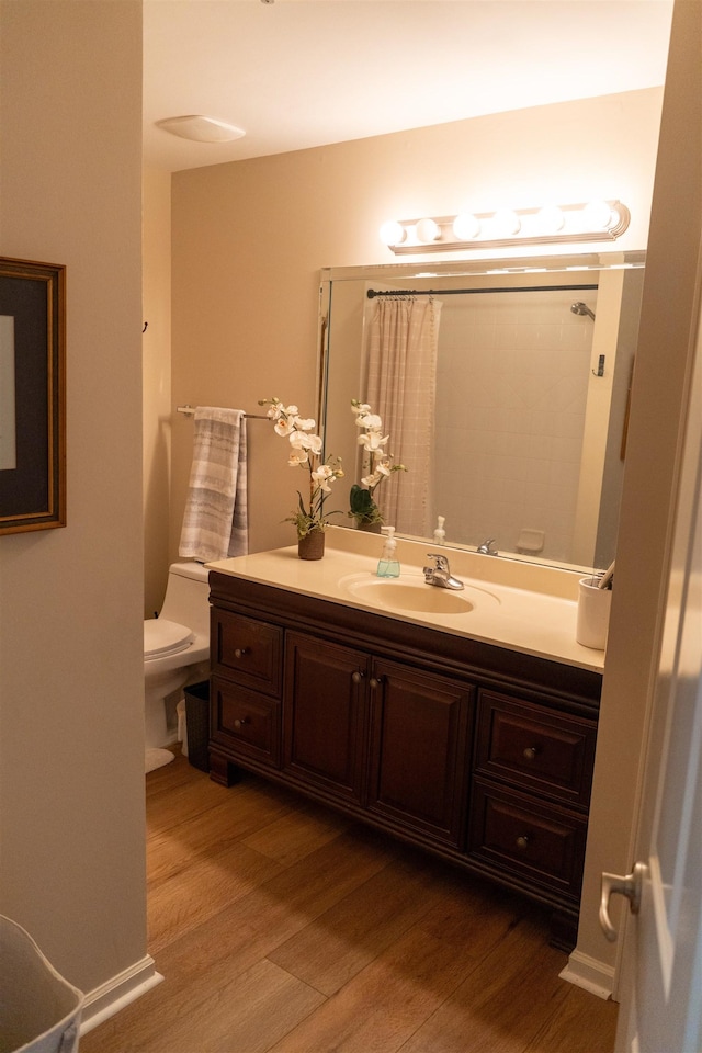 301 Stonevillage Dr W Unit 51, Collierville, TN 38017 - bathroom featuring toilet, wood finished floors, vanity, and a shower with shower curtain