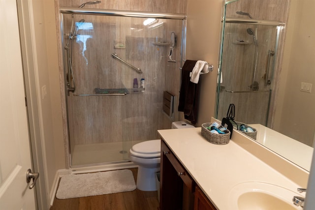 301 Stonevillage Dr W Unit 51, Collierville, TN 38017 - full bathroom with toilet, a stall shower, vanity, and wood finished floors
