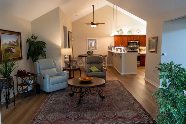 301 Stonevillage Dr W Unit 51, Collierville, TN 38017 - living area featuring light wood-style floors, ceiling fan, high vaulted ceiling, and baseboards