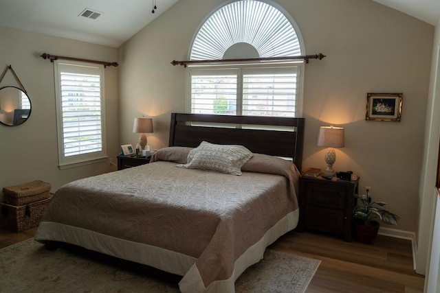 301 Stonevillage Dr W Unit 51, Collierville, TN 38017 - bedroom with lofted ceiling, wood finished floors, and baseboards