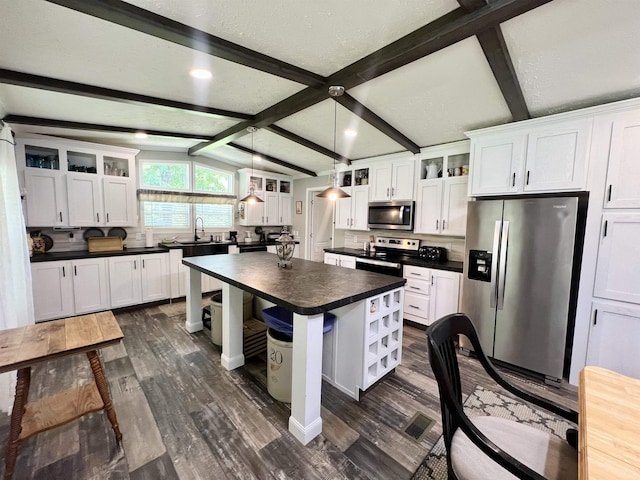 2045 Hardin Graveyard Rd, Adamsville, TN 38310 - kitchen with stainless steel appliances, dark countertops, dark wood-type flooring, white cabinets, and recessed lighting