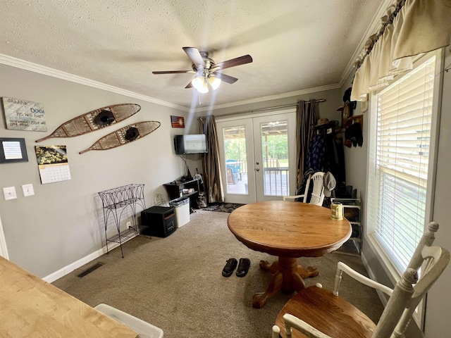 2045 Hardin Graveyard Rd, Adamsville, TN 38310 - carpeted dining room with french doors, healthy amount of natural light, a ceiling fan, ornamental molding, and baseboards