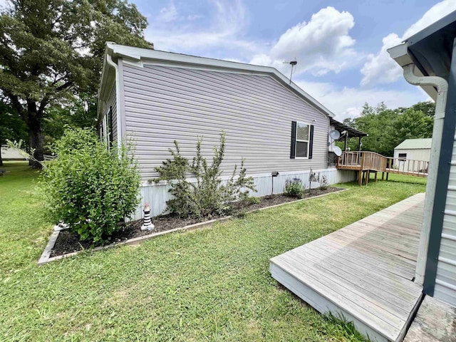 2045 Hardin Graveyard Rd, Adamsville, TN 38310 - view of side of property with a deck and a lawn