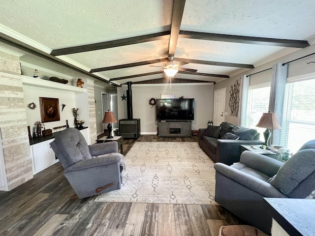 2045 Hardin Graveyard Rd, Adamsville, TN 38310 - living room featuring a wood stove, a textured ceiling, wood finished floors, ceiling fan, and ornamental molding