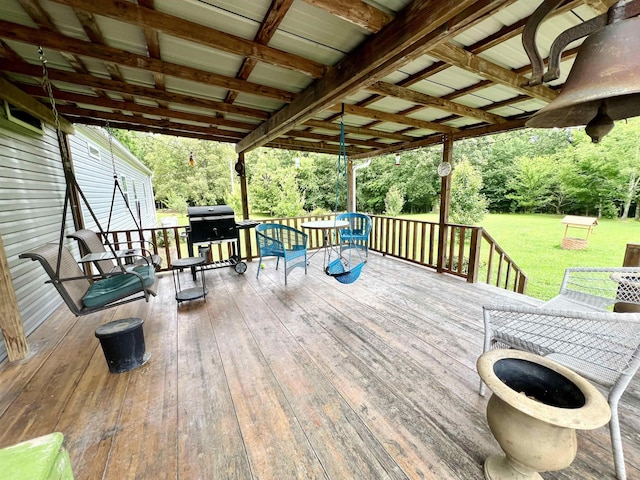 2045 Hardin Graveyard Rd, Adamsville, TN 38310 - wooden terrace featuring a lawn and grilling area