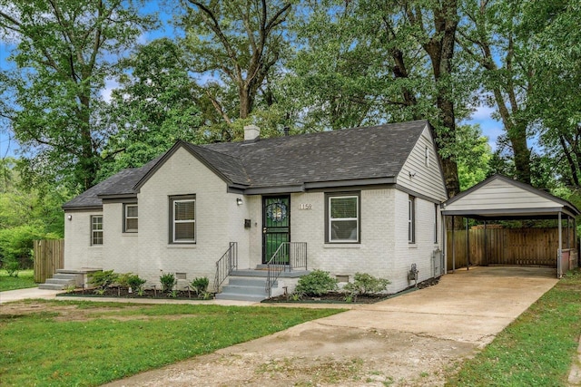 1159 Echles St, Memphis, TN 38111 - bungalow-style house with a detached carport, brick siding, a shingled roof, and concrete driveway