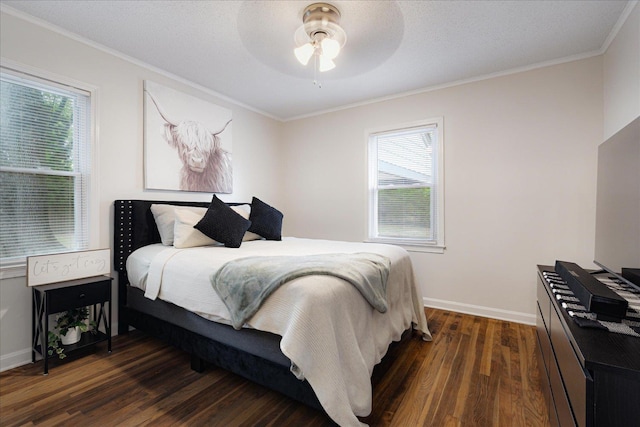 1159 Echles St, Memphis, TN 38111 - bedroom with dark wood-style floors, multiple windows, crown molding, baseboards, and a ceiling fan