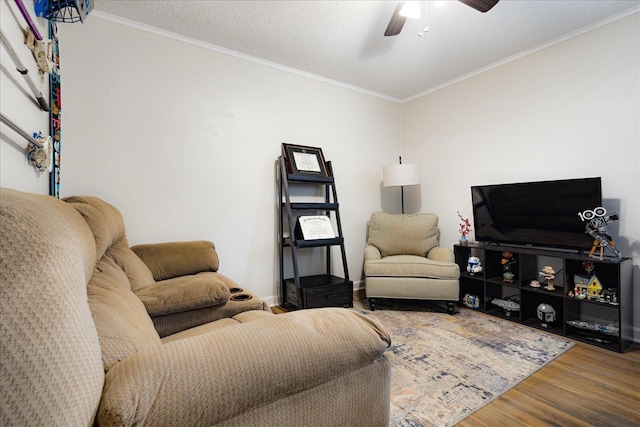 1159 Echles St, Memphis, TN 38111 - living area featuring wood finished floors, a ceiling fan, ornamental molding, and baseboards