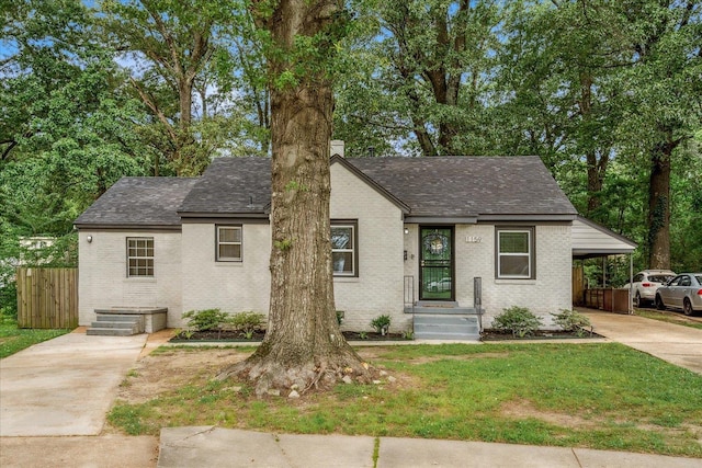1159 Echles St, Memphis, TN 38111 - view of front of property featuring concrete driveway, brick siding, a shingled roof, and an attached carport
