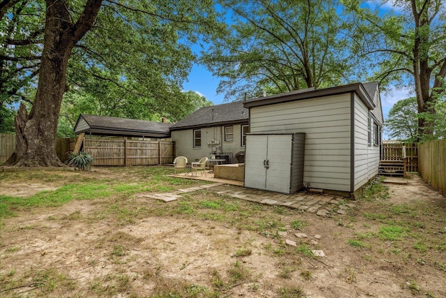 1159 Echles St, Memphis, TN 38111 - back of house with a fenced backyard, a patio area, and an outdoor structure