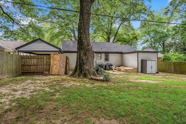 1159 Echles St, Memphis, TN 38111 - rear view of property featuring a patio area and a detached carport