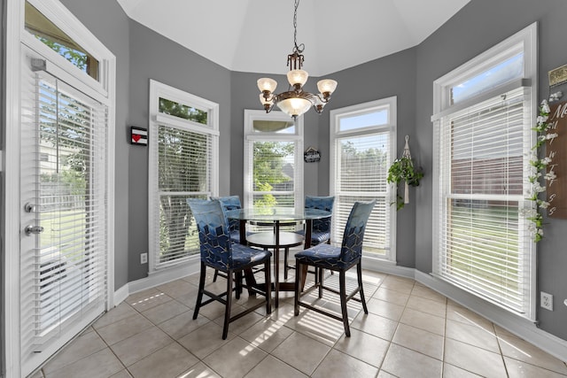 420 Estanaula Rd, Collierville, TN 38017 - dining space with baseboards, lofted ceiling, a chandelier, and light tile patterned flooring