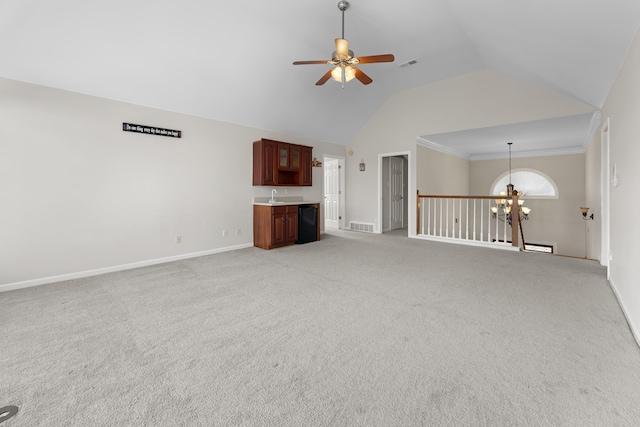 420 Estanaula Rd, Collierville, TN 38017 - unfurnished living room with a sink, ceiling fan, baseboards, a chandelier, and light colored carpet