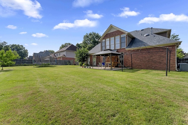 420 Estanaula Rd, Collierville, TN 38017 - view of yard featuring a gazebo, a trampoline, a patio area, and central AC