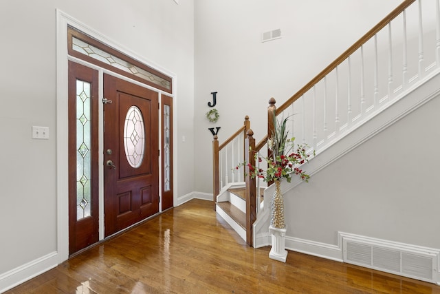 420 Estanaula Rd, Collierville, TN 38017 - entrance foyer with wood finished floors, stairway, baseboards, and a towering ceiling