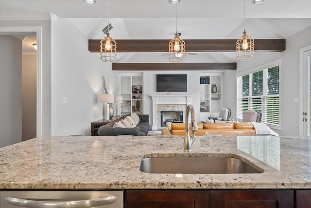 6159 Upper Granger St, Arlington, TN 38002 - kitchen featuring a sink, dark brown cabinets, light stone countertops, beamed ceiling, and pendant lighting