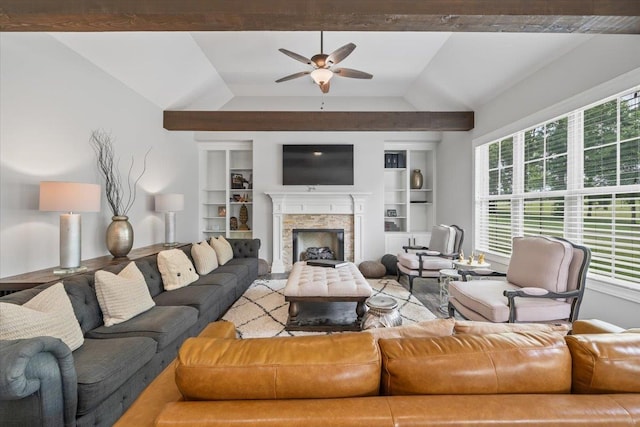 6159 Upper Granger St, Arlington, TN 38002 - living area featuring vaulted ceiling, built in features, ceiling fan, and a stone fireplace