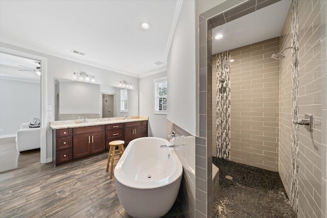 6159 Upper Granger St, Arlington, TN 38002 - full bath featuring crown molding, tiled shower, a freestanding tub, double vanity, and wood finished floors