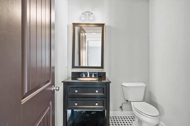 6159 Upper Granger St, Arlington, TN 38002 - half bathroom featuring toilet, baseboards, and vanity
