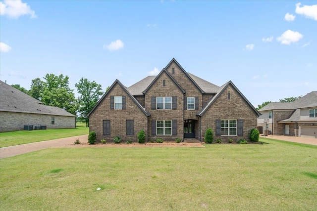 6159 Upper Granger St, Arlington, TN 38002 - view of front of home featuring brick siding, a front yard, and central air condition unit