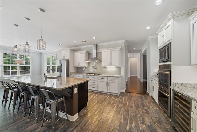 6159 Upper Granger St, Arlington, TN 38002 - kitchen with wall chimney exhaust hood, stainless steel appliances, tasteful backsplash, recessed lighting, and crown molding