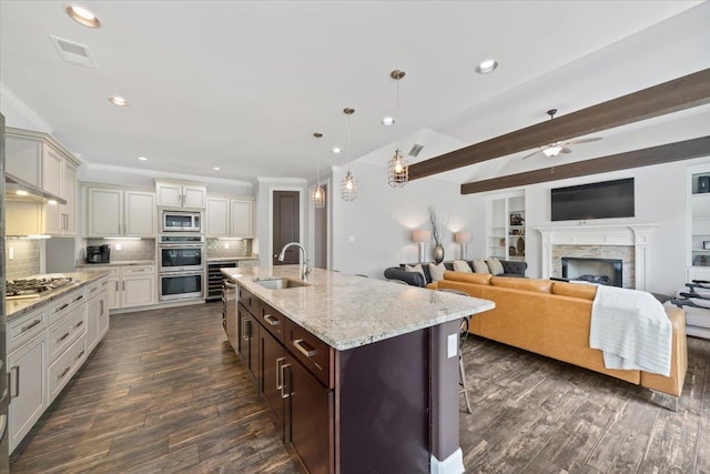 6159 Upper Granger St, Arlington, TN 38002 - kitchen featuring a sink, appliances with stainless steel finishes, ceiling fan, dark wood-style flooring, and beamed ceiling
