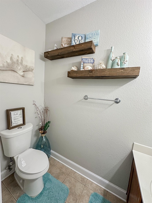 1400 Stable Run Dr, Cordova, TN 38016 - half bath featuring tile patterned floors, toilet, vanity, baseboards, and lofted ceiling