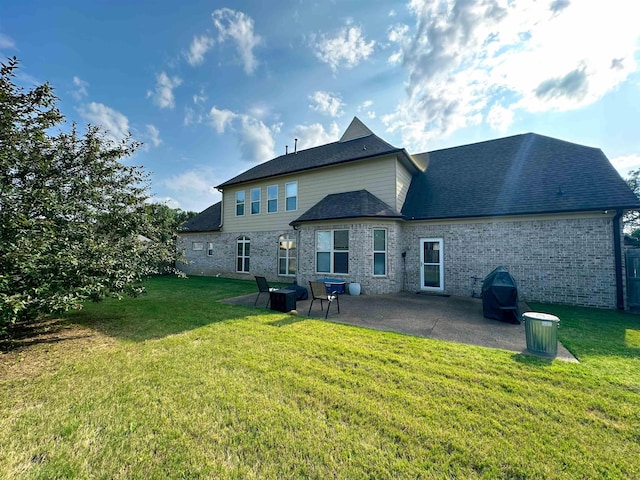 1400 Stable Run Dr, Cordova, TN 38016 - rear view of house featuring a patio area, a yard, brick siding, and a shingled roof