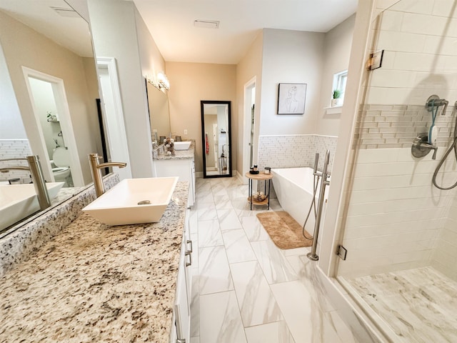 1400 Stable Run Dr, Cordova, TN 38016 - full bathroom featuring a shower stall, vanity, a freestanding bath, toilet, and marble look tiles