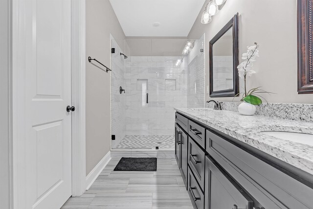 7415 Lost Grove Ln, Cordova, TN 38016 - bathroom featuring double vanity and a shower stall