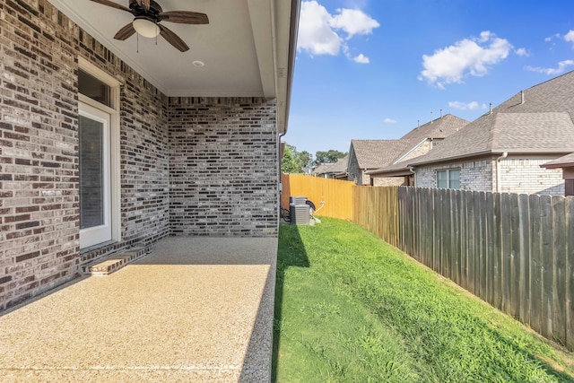 7415 Lost Grove Ln, Cordova, TN 38016 - fenced backyard featuring a ceiling fan and a patio area