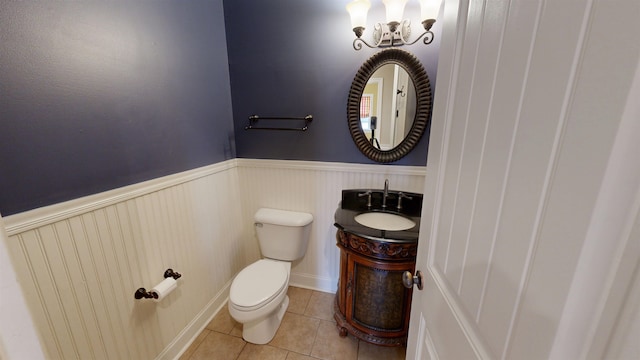4111 Sir Thopas Dr, Southaven, MS 38671 - bathroom with tile patterned floors, vanity, a wainscoted wall, and a chandelier