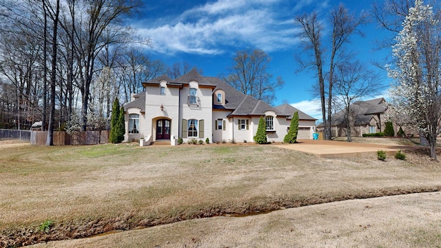 4111 Sir Thopas Dr, Southaven, MS 38671 - french provincial home featuring stucco siding, a garage, concrete driveway, and a shingled roof