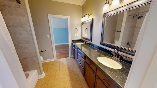4111 Sir Thopas Dr, Southaven, MS 38671 - bathroom featuring double vanity, tile patterned floors, shower / bath combo with shower curtain, and crown molding