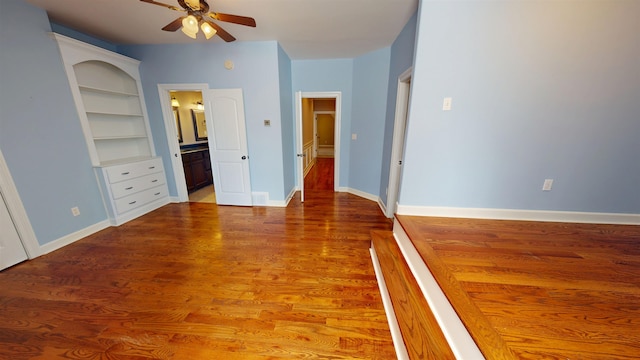 4111 Sir Thopas Dr, Southaven, MS 38671 - unfurnished bedroom featuring light wood-style flooring, connected bathroom, and ceiling fan