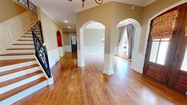4111 Sir Thopas Dr, Southaven, MS 38671 - entryway with a decorative wall, arched walkways, crown molding, wainscoting, and stairway