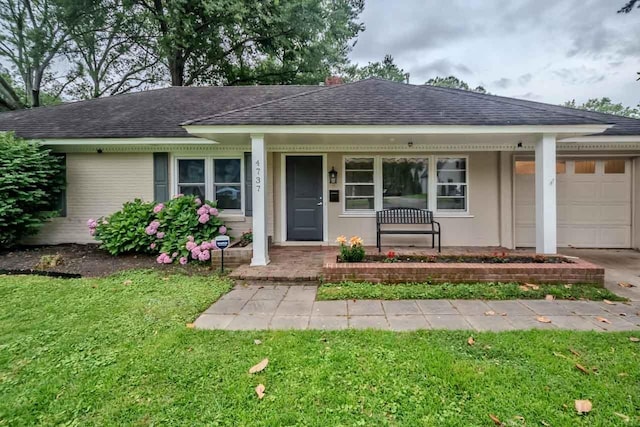 4737 Sequoia Ave, Memphis, TN 38117 - ranch-style home featuring a porch, an attached garage, a shingled roof, and a front yard
