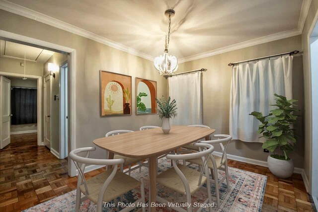 4737 Sequoia Ave, Memphis, TN 38117 - dining area with attic access, crown molding, and a chandelier