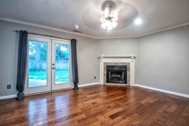 4737 Sequoia Ave, Memphis, TN 38117 - unfurnished living room featuring wood finished floors, ceiling fan, ornamental molding, a tiled fireplace, and french doors
