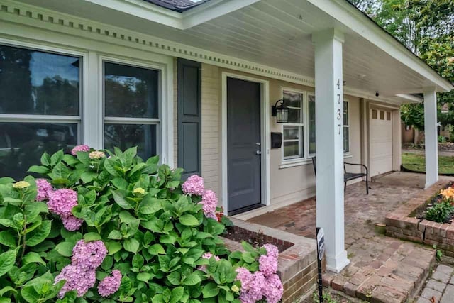4737 Sequoia Ave, Memphis, TN 38117 - view of exterior entry featuring covered porch and a garage