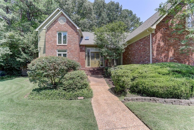 2994 Oakleigh Ln, Germantown, TN 38138 - traditional-style home featuring brick siding, a front lawn, and roof with shingles