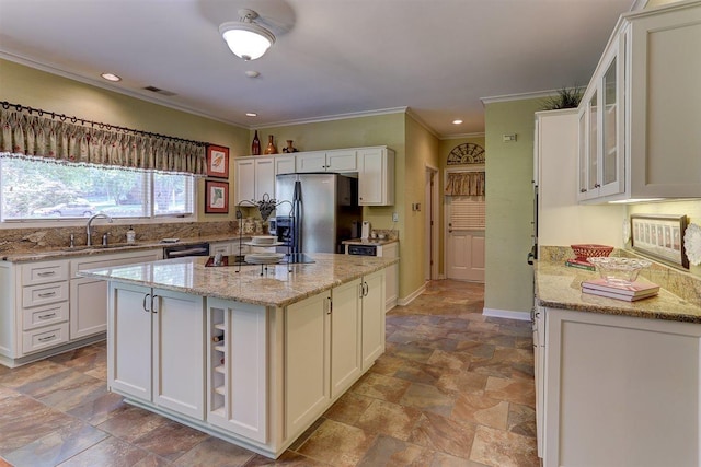 2994 Oakleigh Ln, Germantown, TN 38138 - kitchen with refrigerator with ice dispenser, stone finish flooring, white cabinetry, crown molding, and light stone countertops