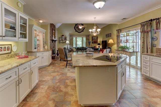 2994 Oakleigh Ln, Germantown, TN 38138 - kitchen featuring open floor plan, black electric stovetop, a chandelier, a center island, and pendant lighting