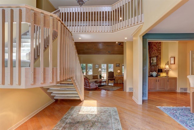 2994 Oakleigh Ln, Germantown, TN 38138 - foyer with stairs, wood finished floors, and a high ceiling