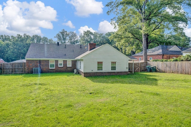 3051 Overbrook Dr, Memphis, TN 38128 - back of property with a chimney, a fenced backyard, and brick siding