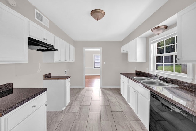 3051 Overbrook Dr, Memphis, TN 38128 - kitchen with dishwasher, under cabinet range hood, plenty of natural light, and white cabinets