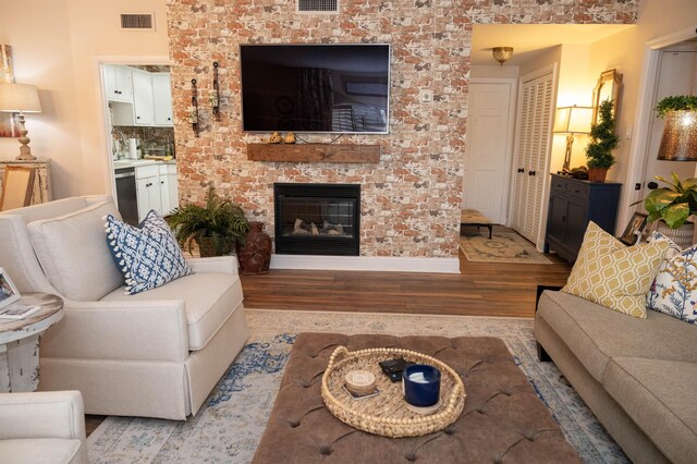 475 N Highland St Unit 3H, Memphis, TN 38122 - living area with wood finished floors and a brick fireplace