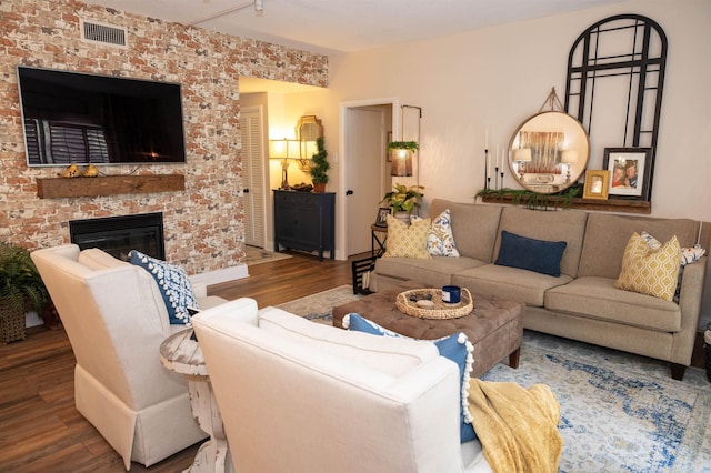 475 N Highland St Unit 3H, Memphis, TN 38122 - living room with wood finished floors and a fireplace